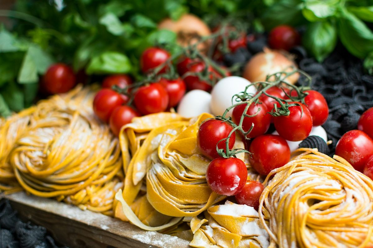 Fresh pasta, tomatoes and basil (stock photo placeholder)